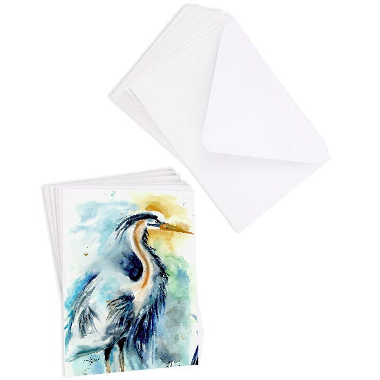 A stack of flat cardstock note cards featuring original watercolor piece Male Heron next to a stack of the matching euro flap envelopes.