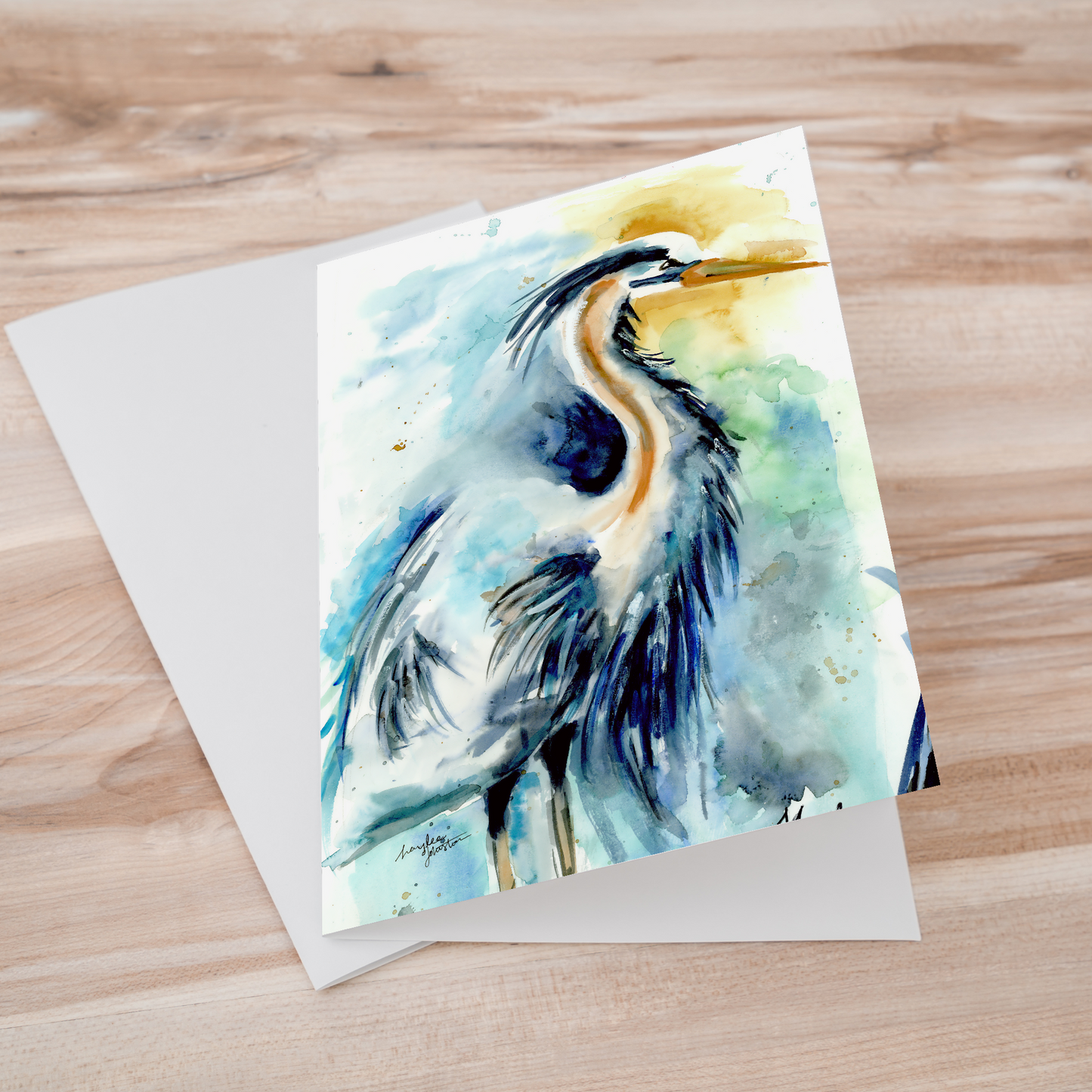 Folding cardstock greeting card featuring original watercolor piece Male Heron laying one on top of another.