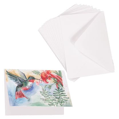 Folding cardstock greeting card featuring original watercolor piece A Garden Visit laying next to a stack of euro flap envelopes.