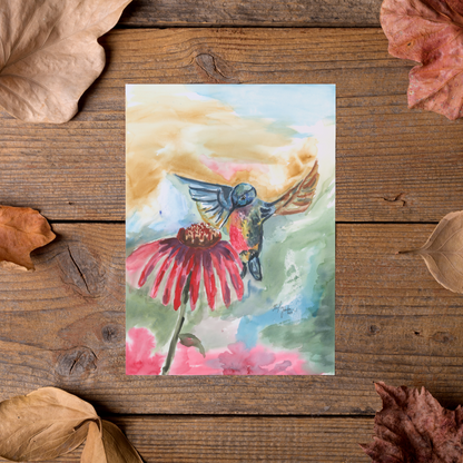 Flat cardstock note card featuring original watercolor piece A Jeweled Messenger styled on rustic wooden boards with dried autumn leaves.