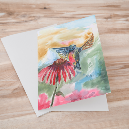 Folding cardstock greeting card featuring original watercolor piece A Jeweled Messenger laying one on top of another.
