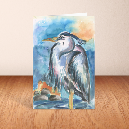 Folding cardstock greeting card featuring original watercolor piece Dark Heron standing upright on a wooden table.