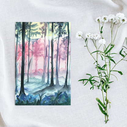 Flat cardstock note card featuring original watercolor piece Fairy Forest on a white linen background next to fresh white flowers.