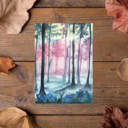 Flat cardstock note card featuring original watercolor piece Fairy Forest styled on rustic wooden boards with dried autumn leaves.