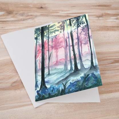 Folding cardstock greeting card featuring original watercolor piece Fairy Forest laying one on top of another.
