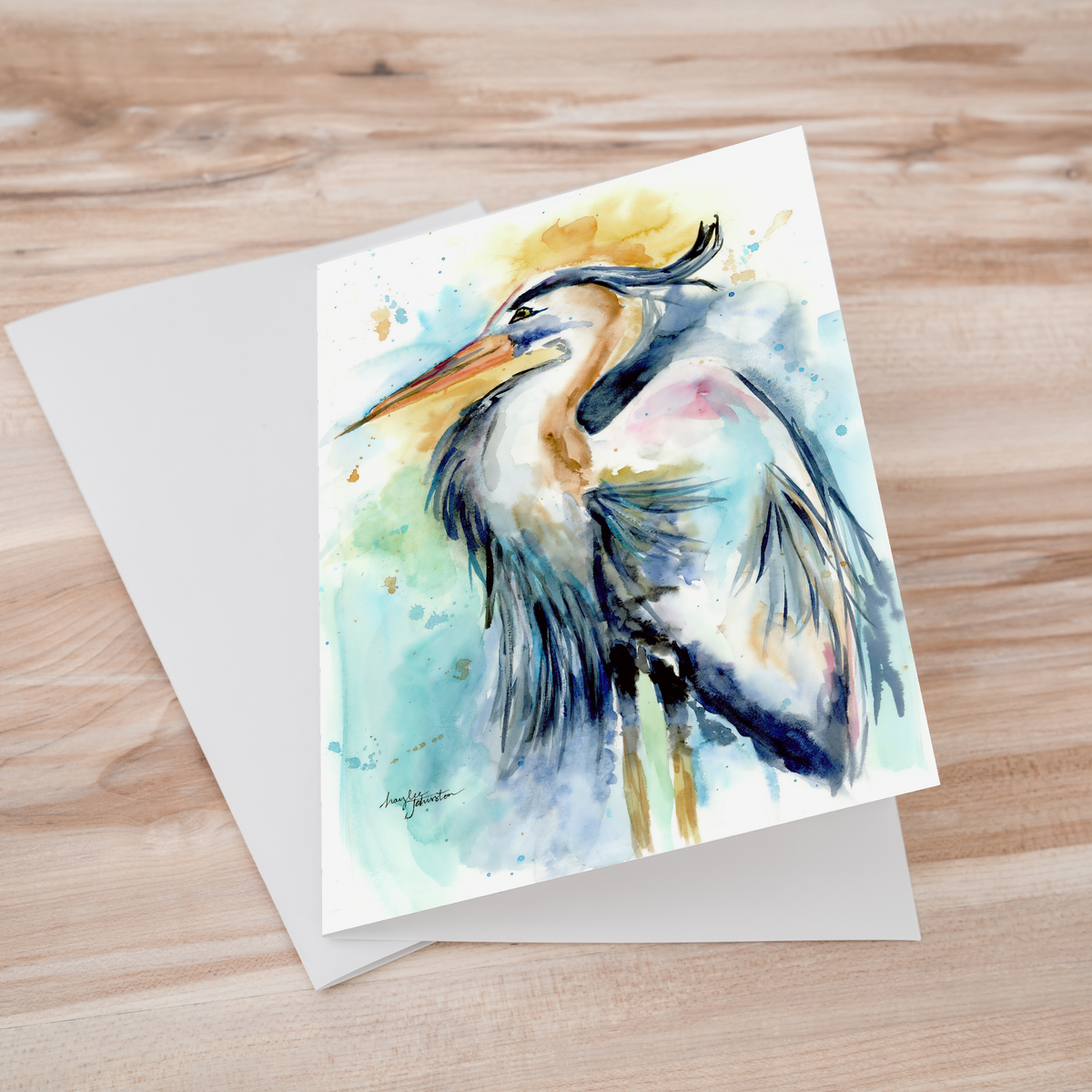Folding cardstock greeting card featuring original watercolor piece Female Heron laying one on top of another.
