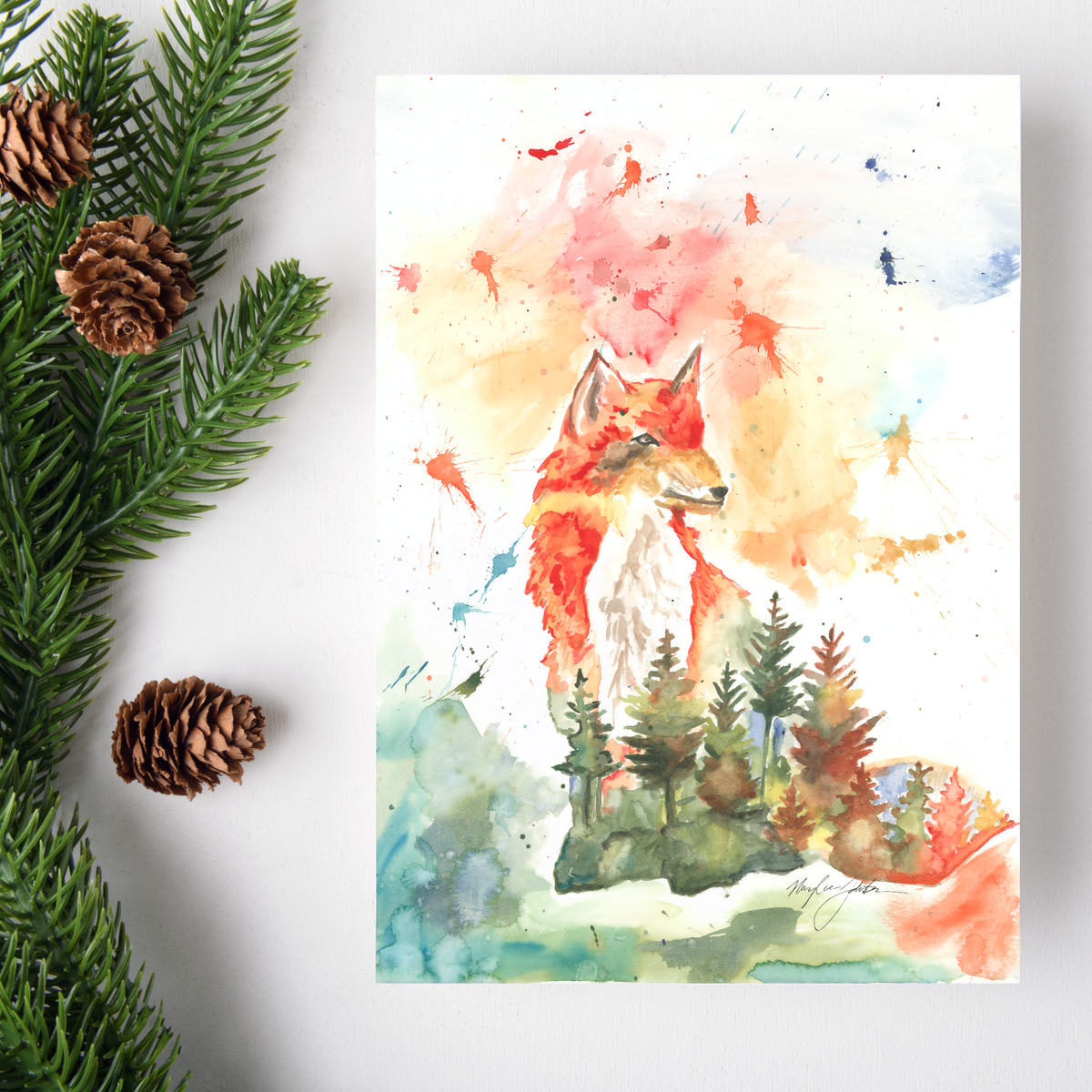 Flat cardstock note card featuring original watercolor piece Forest Fox on a white background. Green pine fronds with brown pinecones decorate the left side.