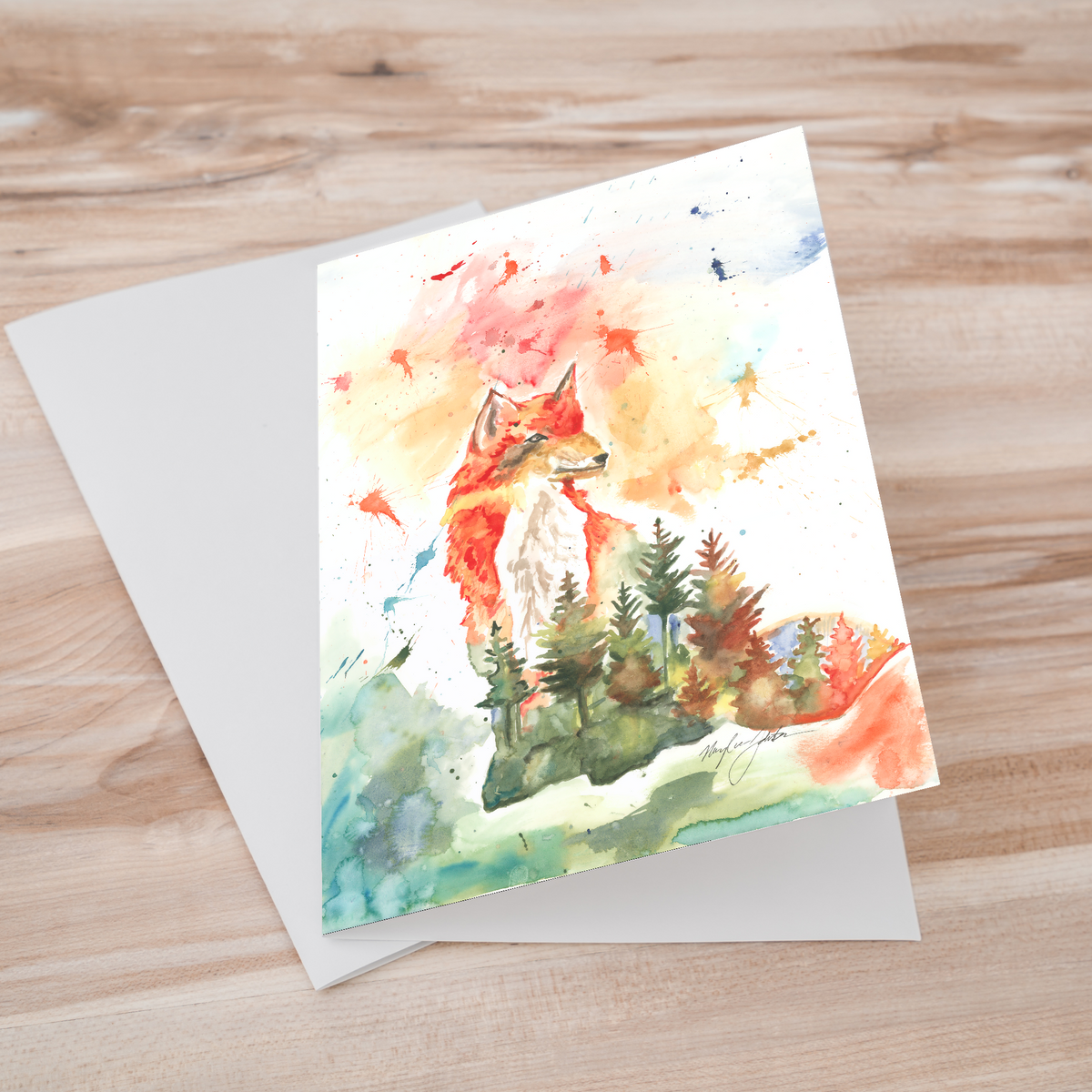 Folding cardstock greeting card featuring original watercolor piece Forest Fox laying one on top of another.