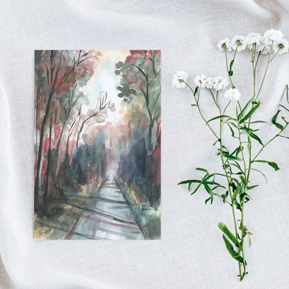 Flat cardstock note card featuring original watercolor piece Forest Road on a white linen background next to fresh white flowers.