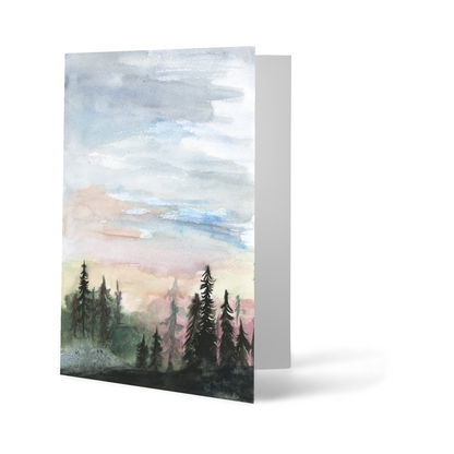 Folding cardstock greeting card featuring original watercolor piece Forest Skyline standing upright.