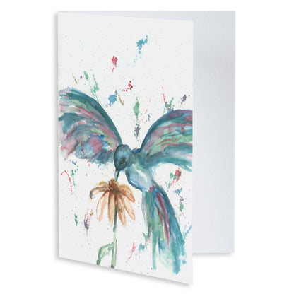 Folding cardstock greeting card featuring original watercolor piece Hovering Hummingbird slightly open to display the empty inside.