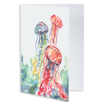 Folding cardstock greeting card featuring original watercolor piece Jellyfish Bloom slightly open to display the empty inside.