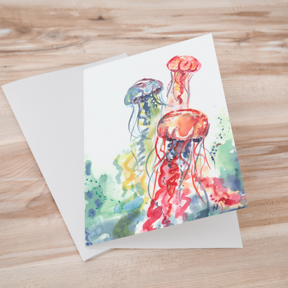 Folding cardstock greeting card featuring original watercolor piece Jellyfish Bloom laying one on top of another.