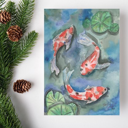 Flat cardstock note card featuring original watercolor piece Koi Pond on a white background. Green pine fronds with brown pinecones decorate the left side.