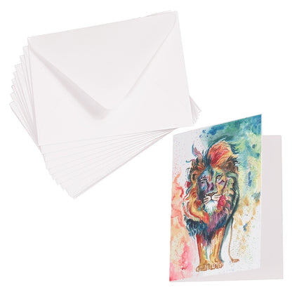 Folding cardstock greeting card featuring original watercolor piece Lion of Judah laying next to a stack of euro flap envelopes.