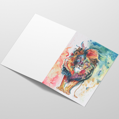 Folding cardstock greeting card featuring original watercolor piece Lion of Judah laying open in a table with the outside facing up.