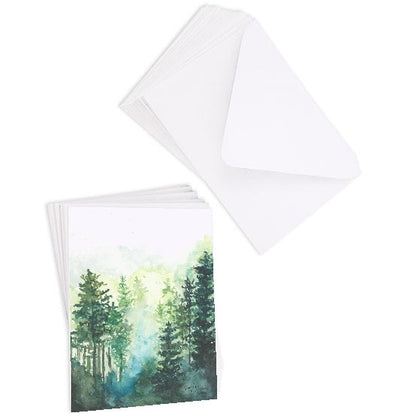 A stack of flat cardstock note cards featuring original watercolor piece Morning Forest next to a stack of the matching euro flap envelopes.