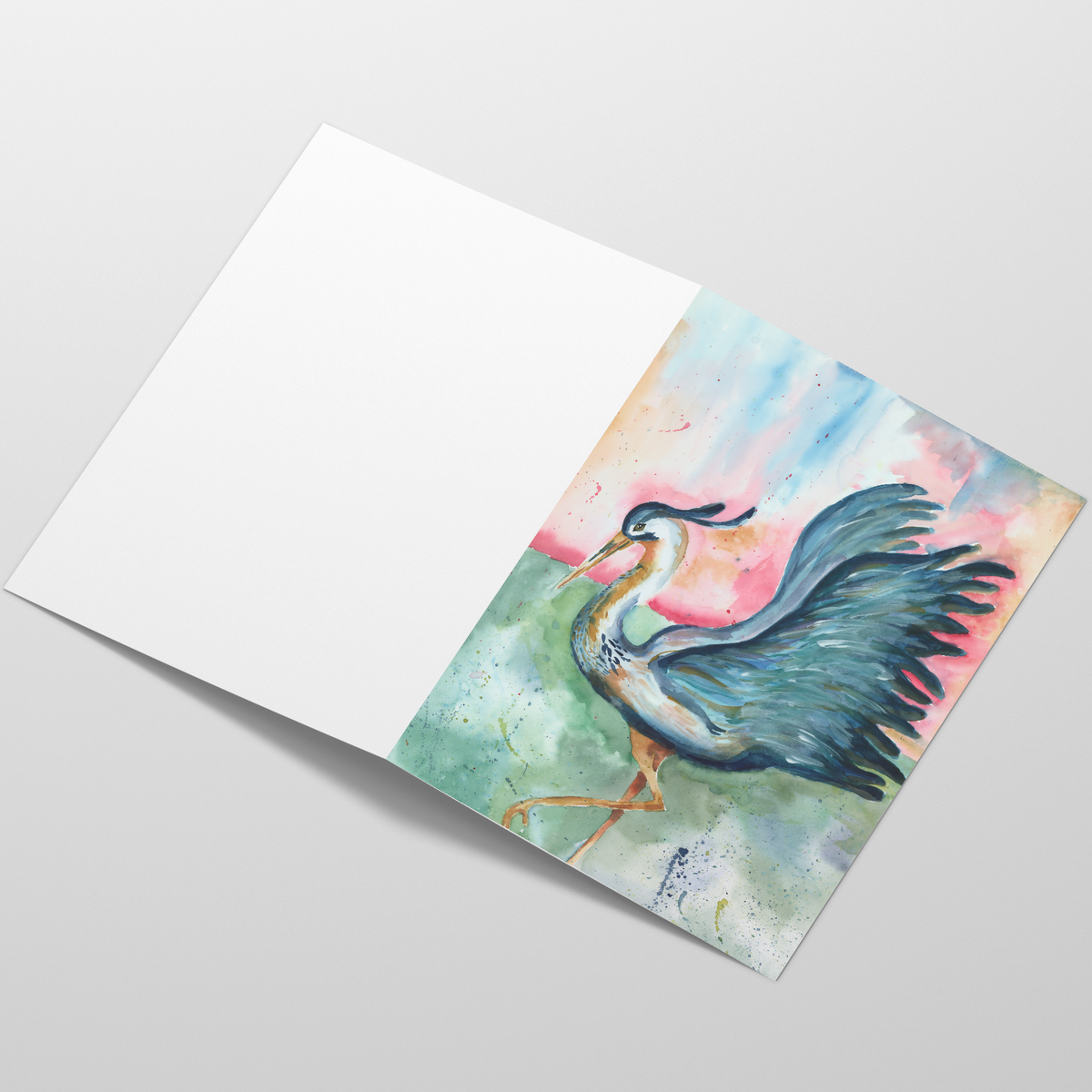 Folding cardstock greeting card featuring original watercolor piece Morning Glories laying open in a table with the outside facing up.