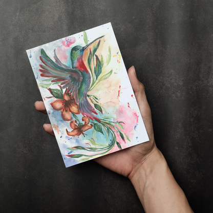 Flat cardstock note card featuring original watercolor piece Queen of Flight in a person's right hand. The background transitions from black at the bottom to a dull gray at the top.