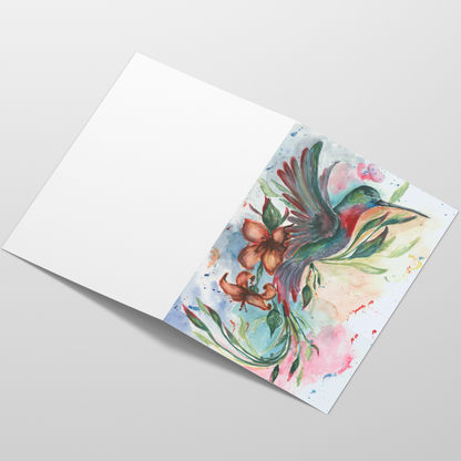 Folding cardstock greeting card featuring original watercolor piece Queen of Flight laying open in a table with the outside facing up.