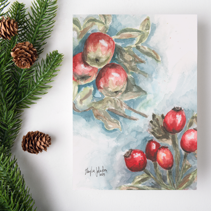 Flat cardstock note card featuring original watercolor piece Red Apples and Rosehips on a white background. Green pine fronds with brown pinecones decorate the left side.