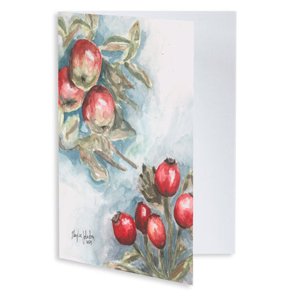Folding cardstock greeting card featuring original watercolor piece Red Apples and Rosehips slightly open to display the empty inside.