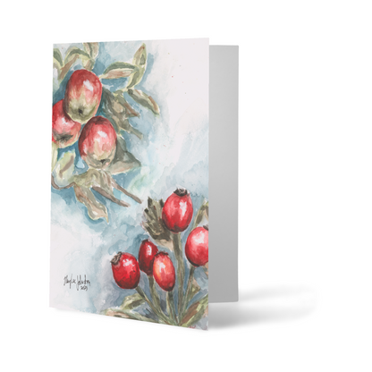 Folding cardstock greeting card featuring original watercolor piece Red Apples and Rosehips standing upright.