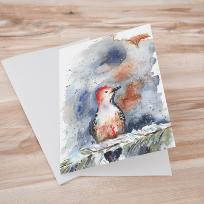 Folding cardstock greeting card featuring original watercolor piece Red Bellied Woodpecker laying one on top of another.