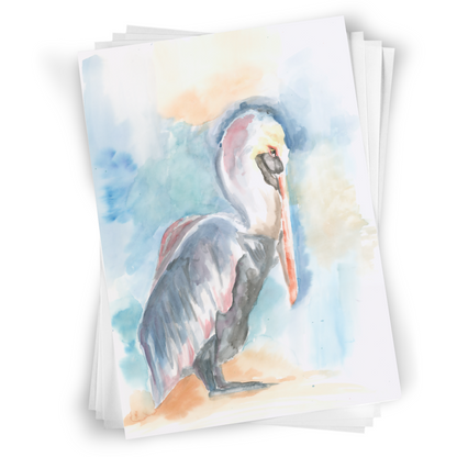 Flat cardstock note card featuring original watercolor piece Shy Pelican in a stack on a white background.