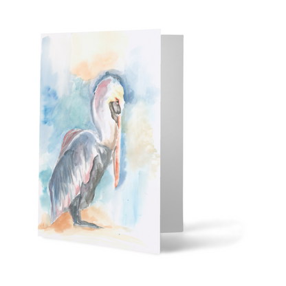 Folding cardstock greeting card featuring original watercolor piece Shy Pelican standing upright.