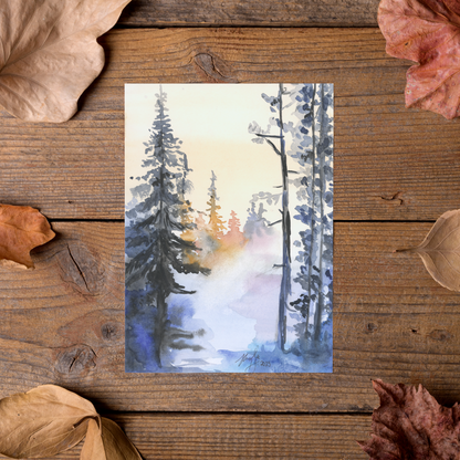 Flat cardstock note card featuring original watercolor piece Winter Wood styled on rustic wooden boards with dried autumn leaves.