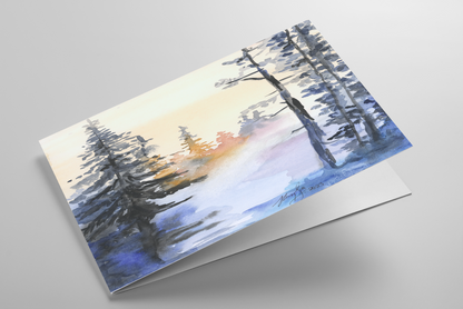 Folding greeting card featuring original watercolor piece Winter Wood laying down showing cardstock thickness and blank inside.