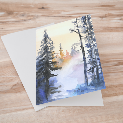 Folding cardstock greeting card featuring original watercolor piece Winter Wood laying one on top of another.